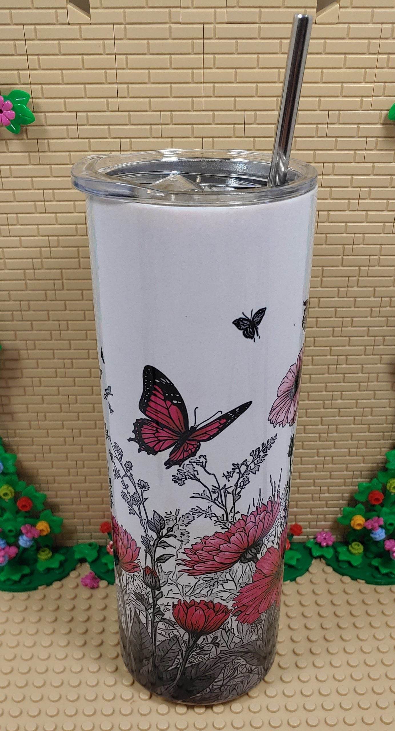 Butterflies and flowers Tumbler