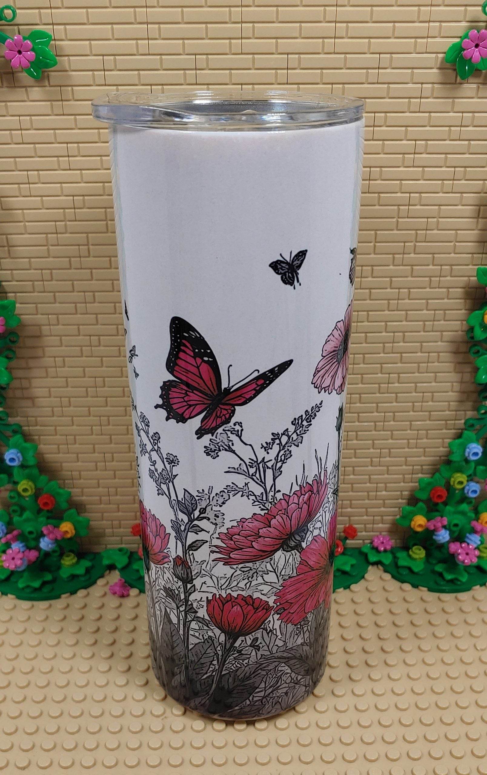 Butterflies and flowers Tumbler